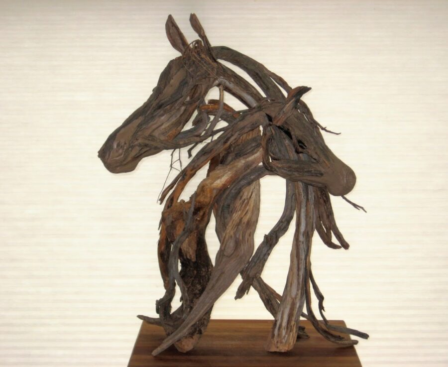 Photo of mixed media two horses heads hugging sculture by Brenna Kimbro